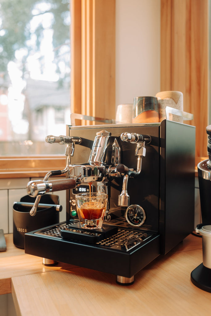 black and walnut touchpoint Profitec Pro 600 pulling a shot lifestyle by Clive Coffee