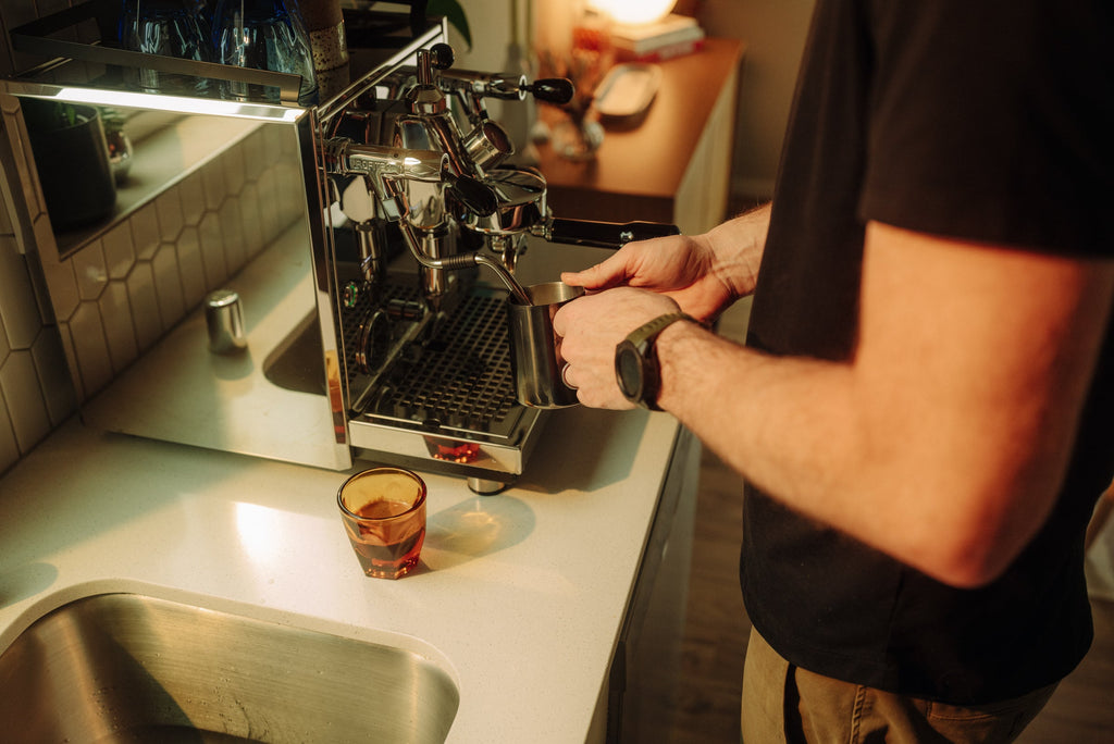 left view of milk steaming on the profitec drive espresso machine lifestyle by clive coffee