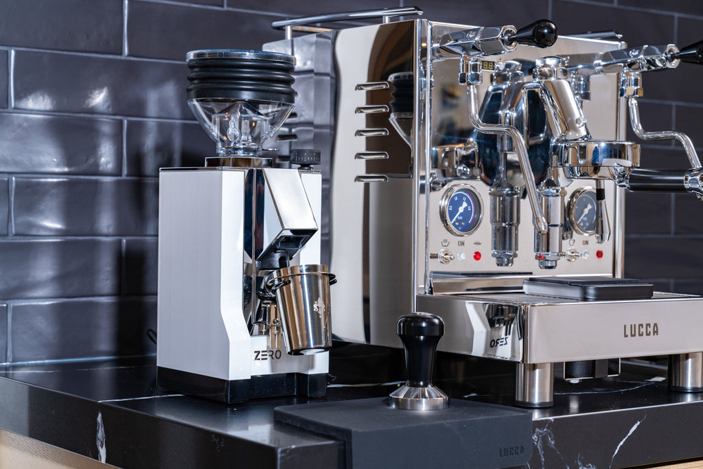 eureka mignon zero espresso grinder in white with the lucca m58 espresso machine in stainless steel lifestyle by clive coffee