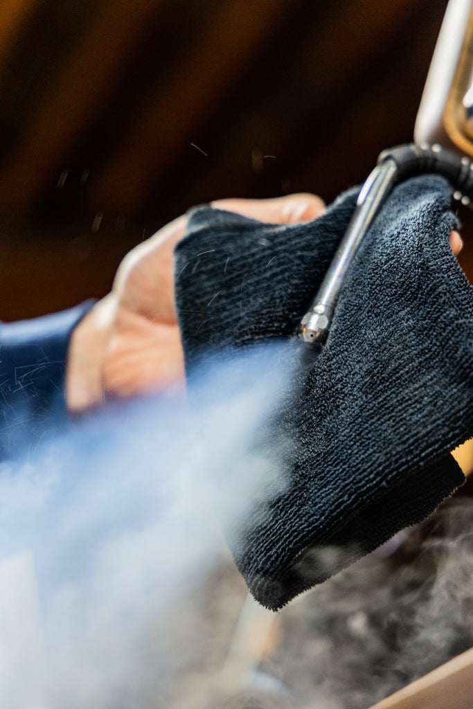 cleanign a steam wand with a micro fiber towel lifestyle by clive coffee