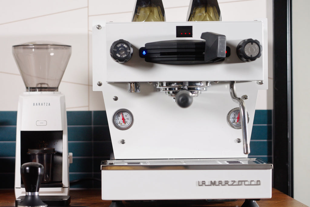 front view of the baratza encore esp grinder and la marzocco linea mini espresso machine lifestyle by clive coffee