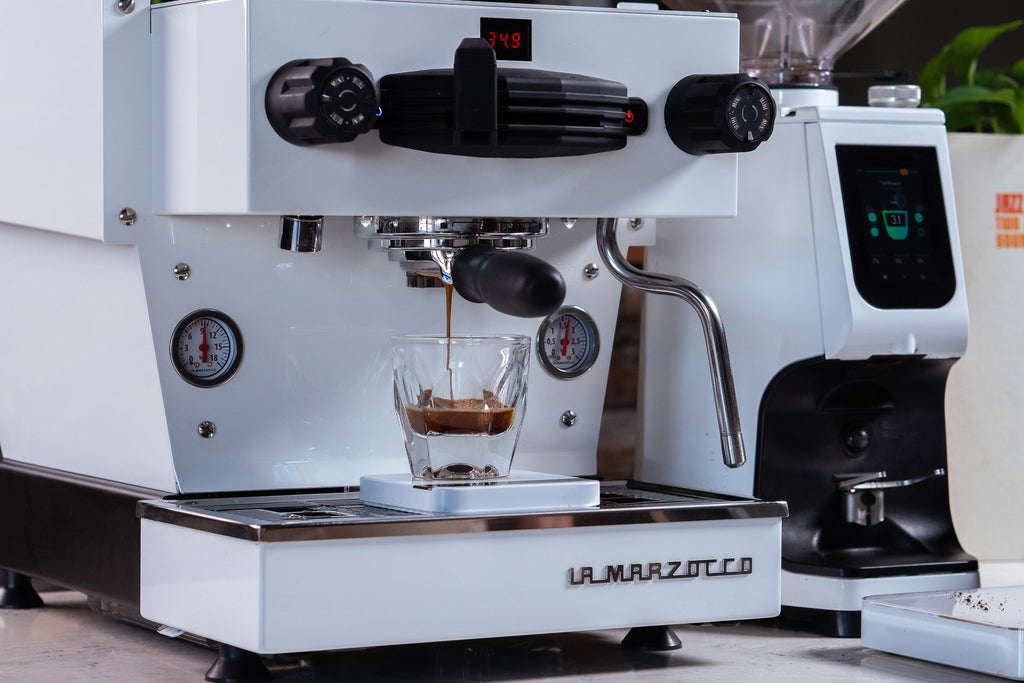 Front view of an espresso shot pulling on the Linea Mini R lifestyle by Clive Coffee