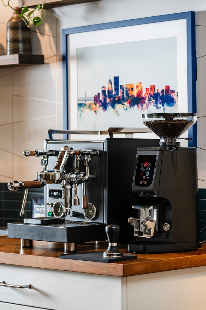 Eureka Atom W 75 (black) espresso grinder side view lifestyle by Clive Coffee