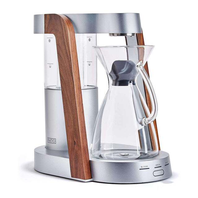 Coffee maker with wooden side and glass carafe on a white background